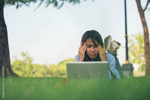 Stress asian women headache have migraine feeling temples stressfull upset depressed. Strong headache migraine exhausted young girl. Office syndrome unhealthy Tension person. Woman headache concept photo