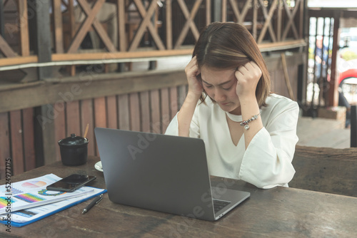 Stress asian women headache have migraine feeling temples stressfull upset depressed. Strong headache migraine exhausted young girl. Office syndrome unhealthy Tension person. Woman headache concept photo