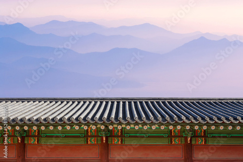 Korean traditional traditional holiday background. Palace with mountain at sunrise. 
