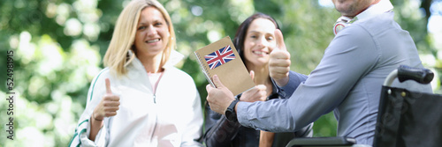 Group of young people are learning English in park photo