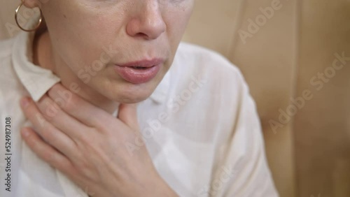 Heart attack with difficult breathing. A view of sick female with heart attack with hard breathing in the room. photo
