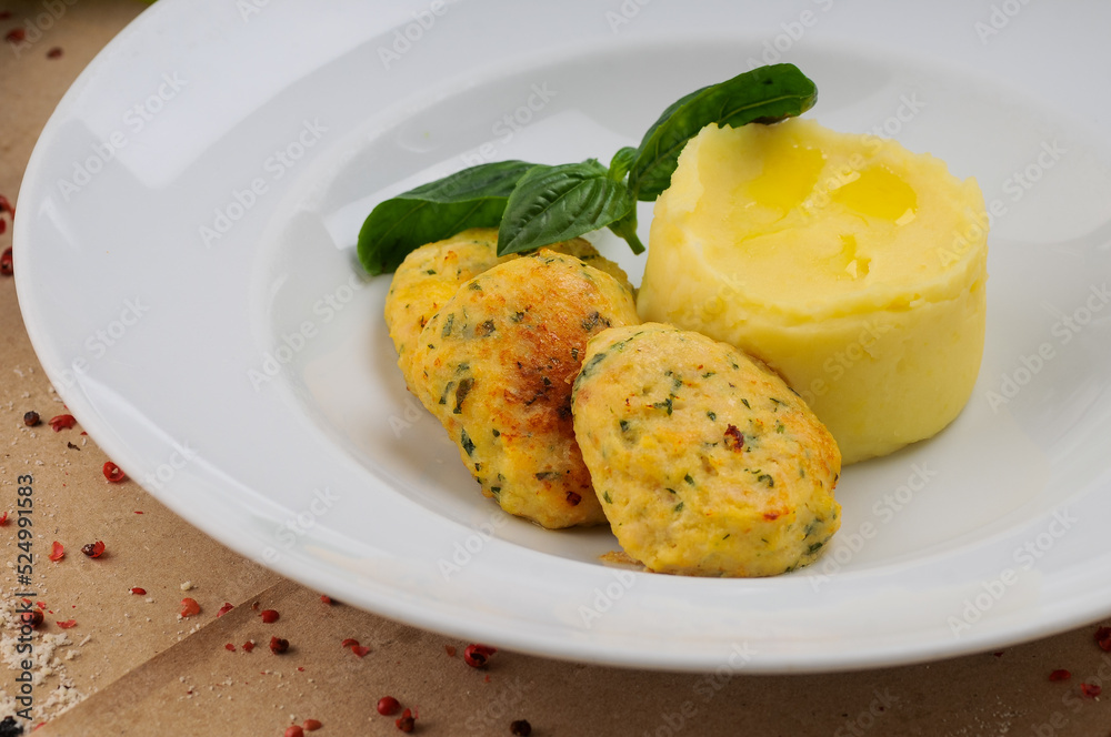 fish cutlets with mashed potatoes in a white plate
fish cutlets with mashed potatoes in a white plate