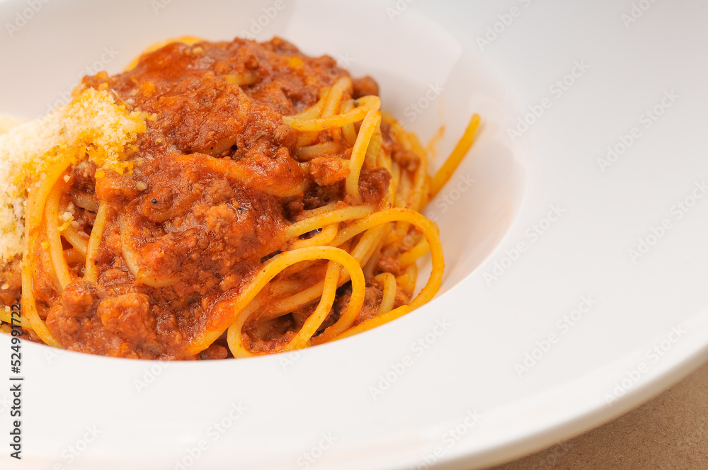 italian pasta with sauce in a white plate macro photo
