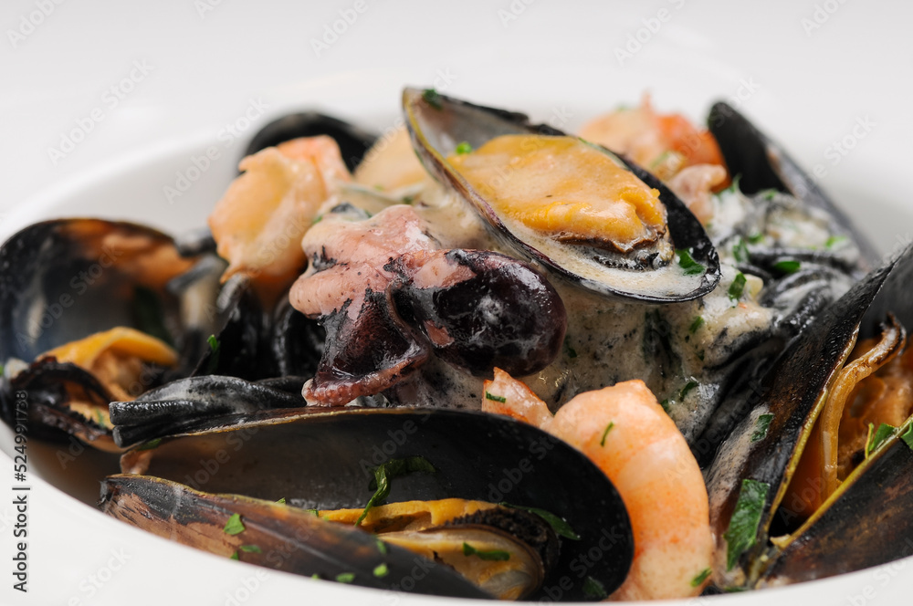 seafood mussels shrimp and octopus in a plate
seafood mussels shrimp and octopus in a plate