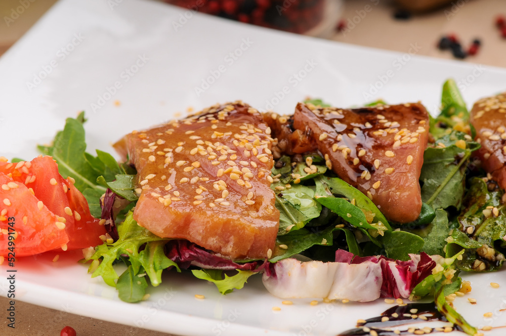 salad with tuna and salmon sprinkled with sesame
salad with tuna and salmon sprinkled with sesame