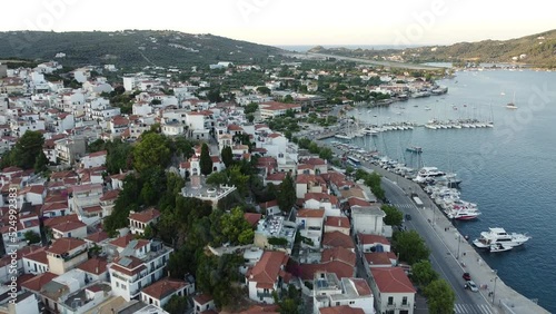 Flying over the harbor and the city of Skiathos in Greece in 4k photo