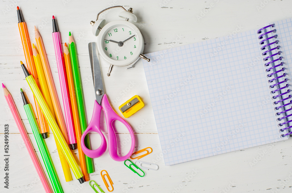Children's accessories for study, creativity and office supplies on a white wooden background. Back to school concept. Copy space Children's accessories for study, creativity and office supplies on a white wooden background. Back to school concept. Copy space