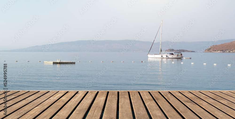 Empty wooden platform on yachts and motor boat in marina port, Aspat Marina. Front view