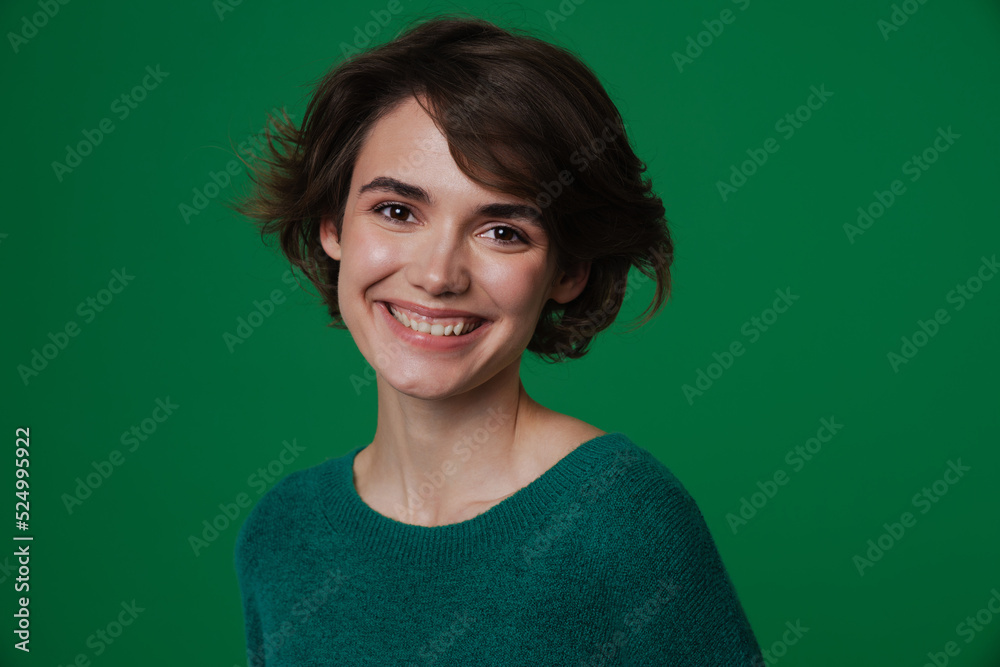 Fototapeta premium Young white woman wearing sweater laughing and looking at camera