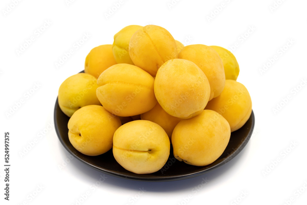 Ripe apricot isolated on white background. Fresh and juicy apricots on the plate. Organic food. close up Ripe apricot isolated on white background. Fresh and juicy apricots on the plate. Organic food. close up