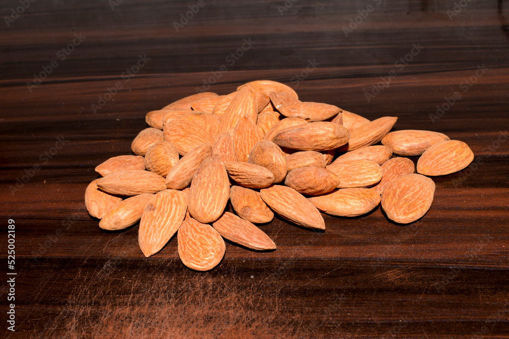 Almonds on wooden table background. Close up Almonds on wooden table background. Close up