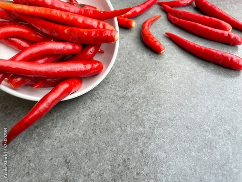 Red chilli on gray background