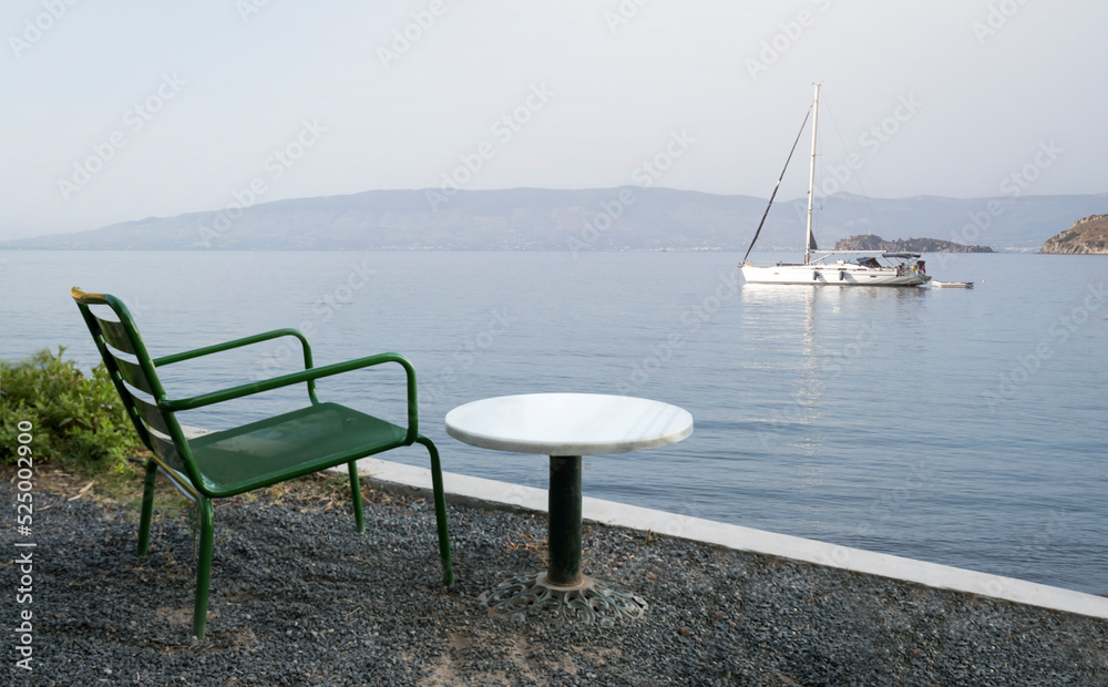 empty marble table in front of yacht background, Aspat Bay. Close up empty marble table in front of yacht background, Aspat Bay. Close up