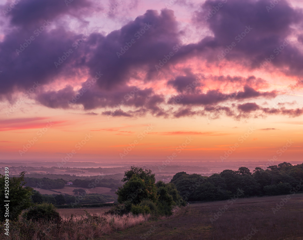 Dramatic August dawn sky from the North's Seat Hastings Country Park East Sussex in the south east of England UK