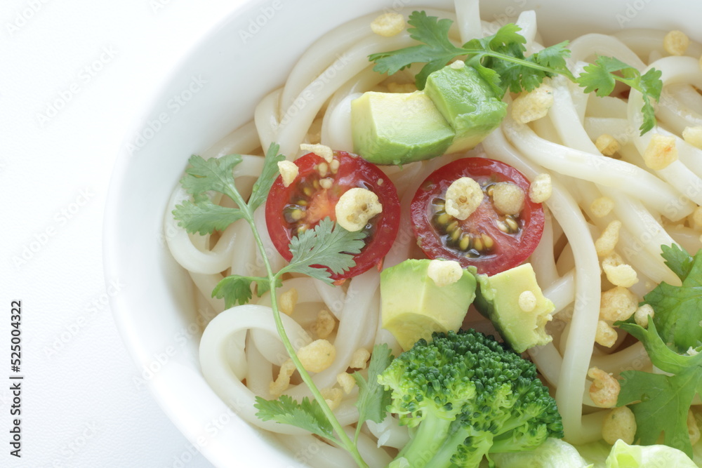 Japanese fusion food, broccoli and cherry tomato with avocado cold udon noodles for Summer cuisine 