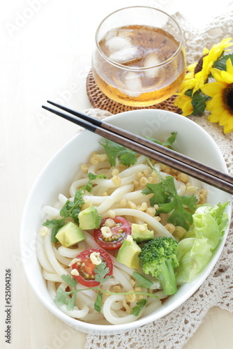 Japanese fusion food, broccoli and cherry tomato with avocado cold udon noodles for Summer cuisine 