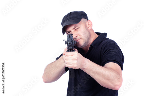 Man pointing AK-47 machine gun, isolated on white. Focus on the gun