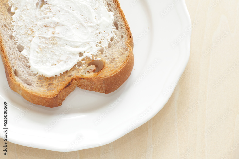 Cream cheese and walnut bread on white plate for breakfast Cream cheese and walnut bread on white plate for breakfast