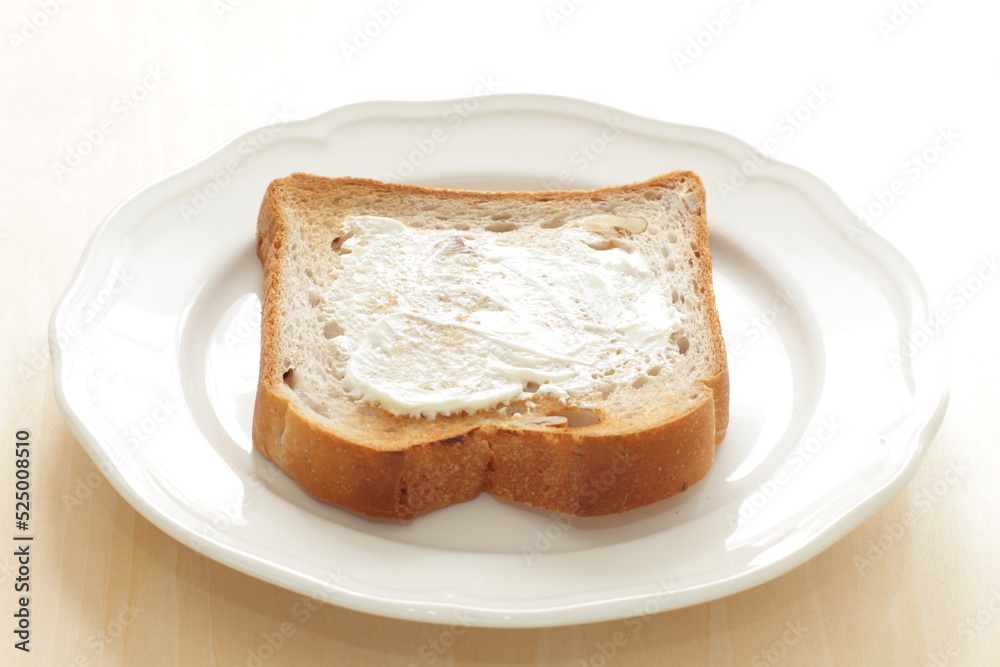 Cream cheese and walnut bread on white plate for breakfast Cream cheese and walnut bread on white plate for breakfast