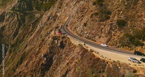 Flying along the road passing through the mountains. Huge rocks of Big Sur Morro Bay in California, USA.