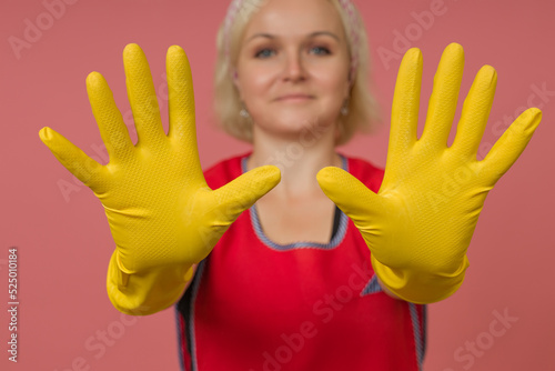 close-up woman cleaner in protective gloves shows empty palms