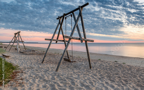 Coastal landscape at colorful dawn,  sandy beach of the Baltic Sea in Jurmala...
