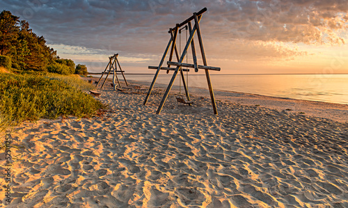Coastal landscape at colorful dawn,  sandy beach of the Baltic Sea in Jurmala...