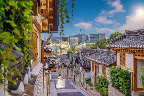 Bukchon Hanok Village with Seoul city skyline, cityscape of South Korea photo