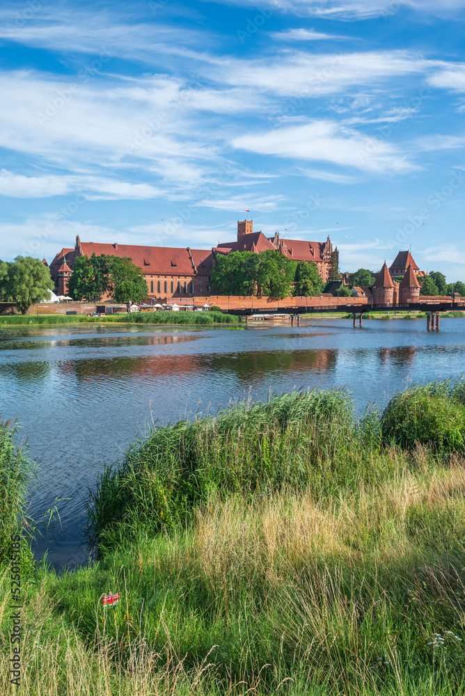 The largest brick castle in the world - Malbork Castle on the Nogat River, Poland The largest brick castle in the world - Malbork Castle on the Nogat River, Poland