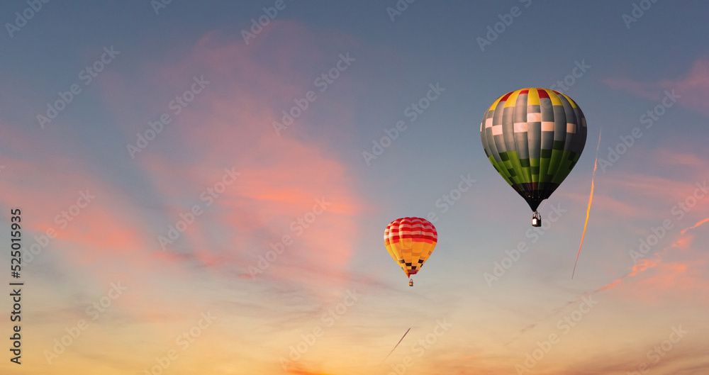 Fototapeta premium Colorful hot air balloons flying on the sunset sky background.