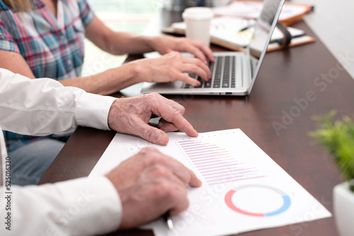 Coworkers analyzing financial data