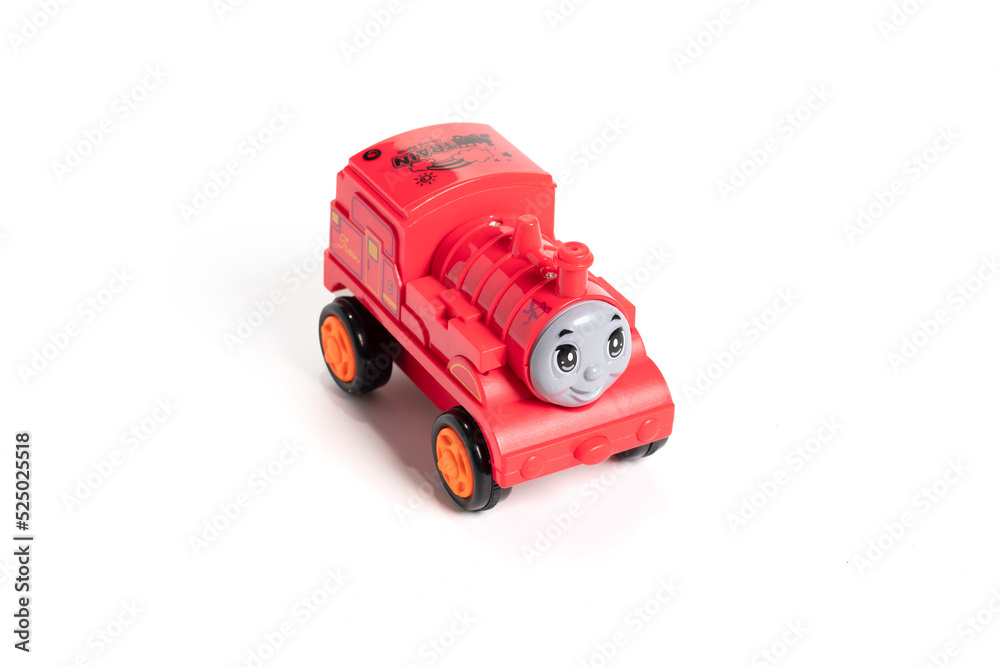 Colorful plastic train, isolated on white background.