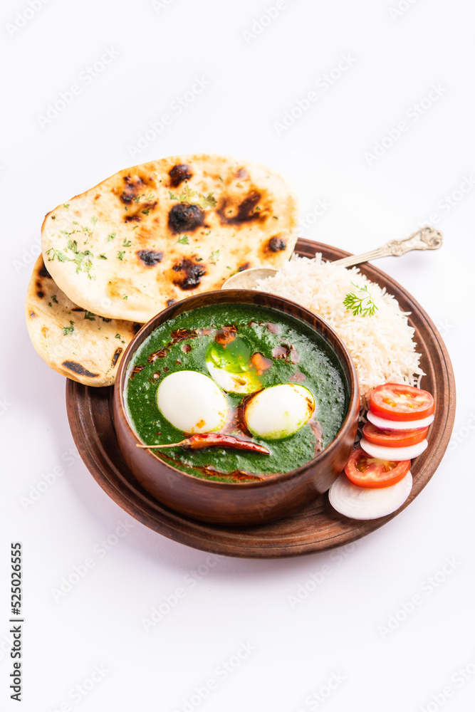 Spinach egg curry is an Indian non vegetarian dish made using palak gravy with eggs