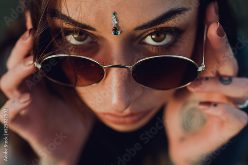 Magnificent trendy adult woman in sunglasses photo