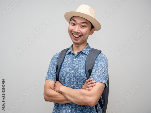Cheerful travler man cross arms happy smile isolated photo