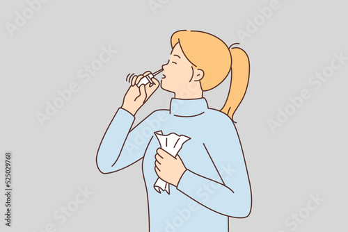 Sick woman use nasal spray 