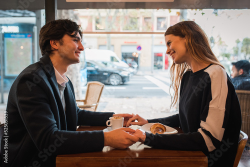 Happy couple having date in cafe