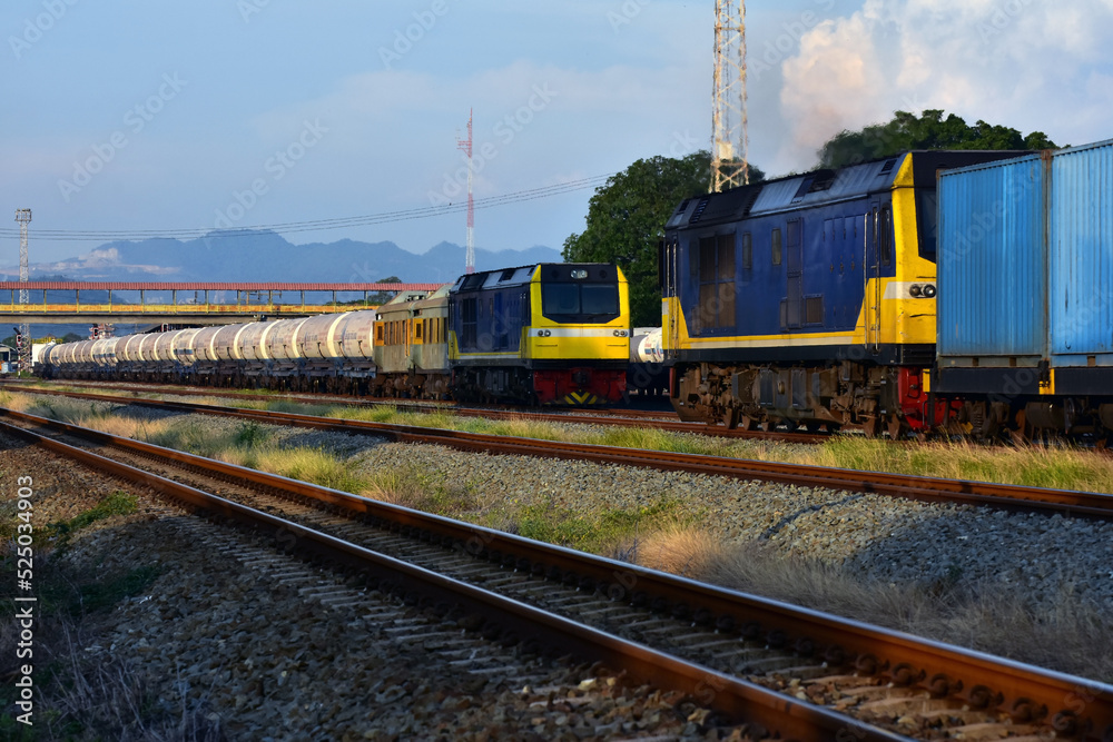 Freight trains by diesel locomotive on the railway yard in Thailand Freight trains by diesel locomotive on the railway yard in Thailand