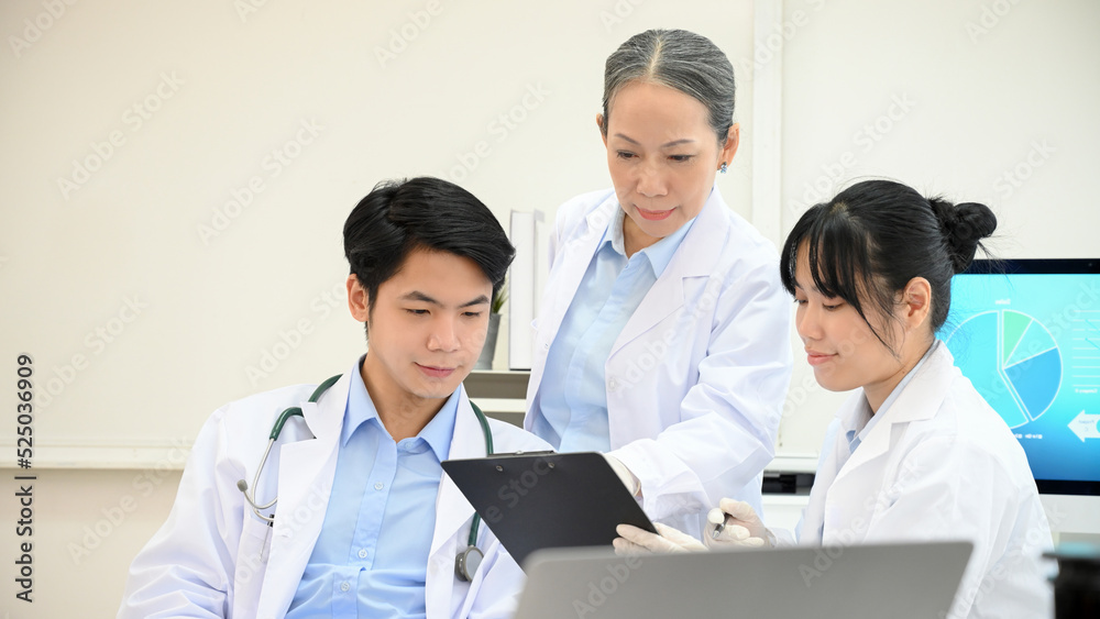 A team of Asian scientist planning and brainstorming on their Microbiology development research A team of Asian scientist planning and brainstorming on their Microbiology development research