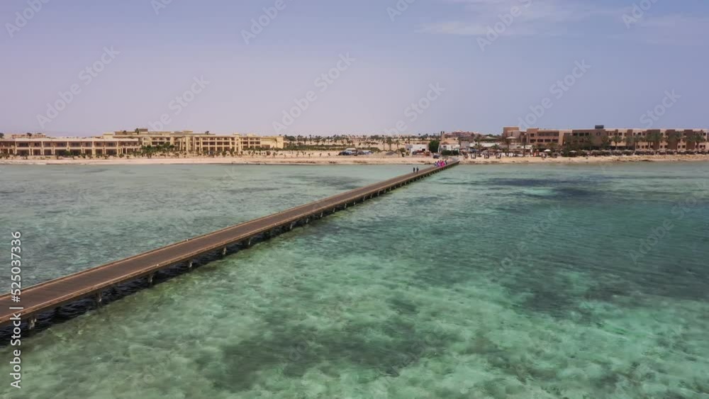 Aerial Pull in Drone shot of Pier and Hotel in Thee Red Sea, Egypt Aerial Pull in Drone shot of Pier and Hotel in Thee Red Sea, Egypt