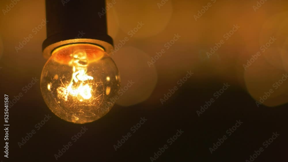 Illuminated light bulb at night, shinning filament, business idea concept
Illuminated light bulb at night, shinning filament, business idea concept