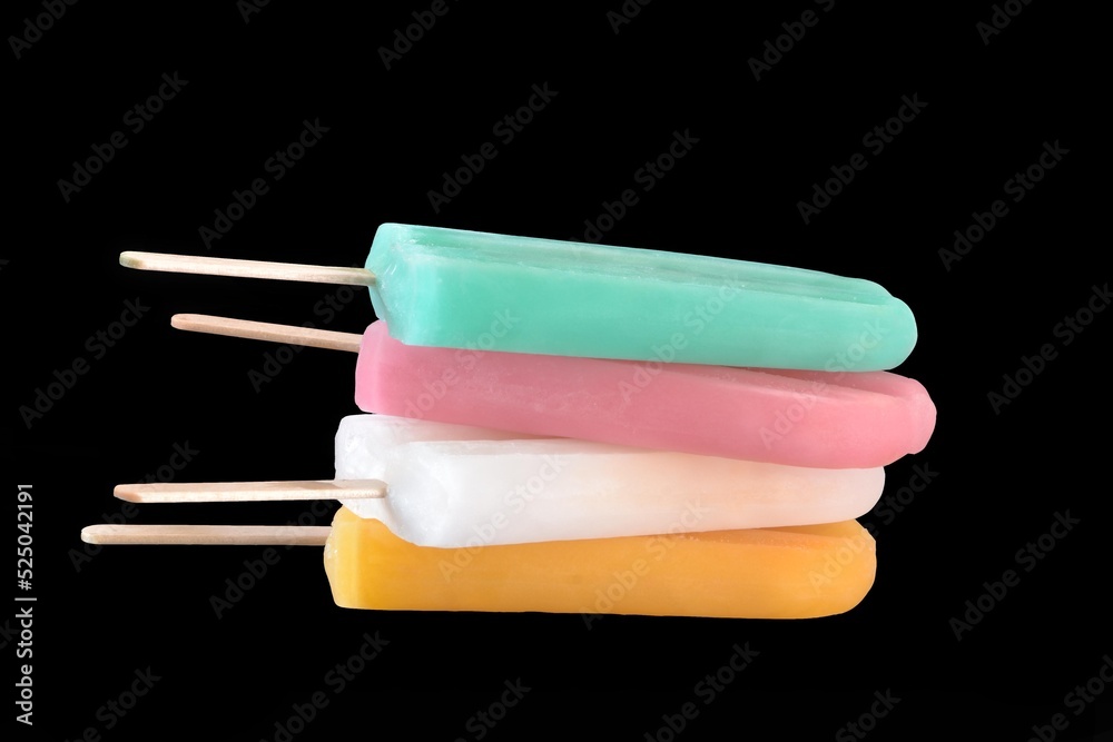 Colorful fruits popsicle ice cream stack on black background. Colorful fruits popsicle ice cream stack on black background.