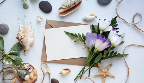 card mockup with shells and sea star leaves and eustoma 