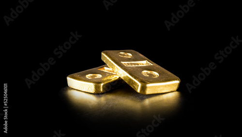 close up pure gold bar ingot put on the black color leather surface background represent the business and finance concept idea