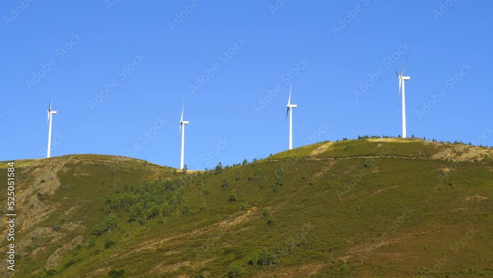 Portugal Eolic Wind turbines at the the of a mountain range Portugal Eolic Wind turbines at the the of a mountain range