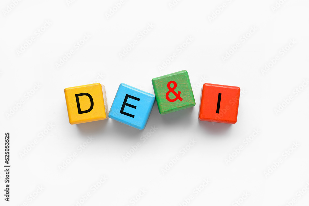 Wooden cubes with abbreviation DE and I (diversity, equity, inclusion) on white background Wooden cubes with abbreviation DE and I (diversity, equity, inclusion) on white background