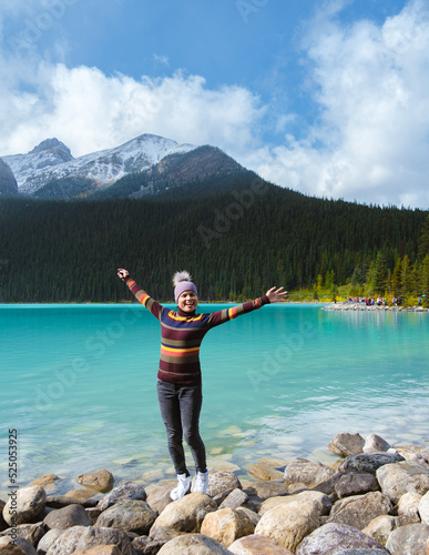 Lake Louise Banff national park, is a lake in the Canadian Rocky Mountains. Young Asian women visiting Lake Louise in Canada during vacation