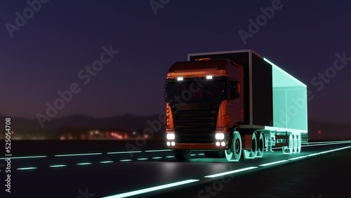 futuristic truck with a trailer is driving along a night road.