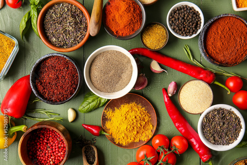 Fototapeta Naklejka Na Ścianę i Meble -  Composition with fresh aromatic spices on color wooden background