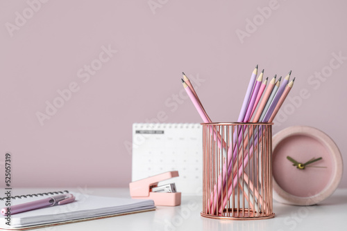 Metal cup with pencils, not...